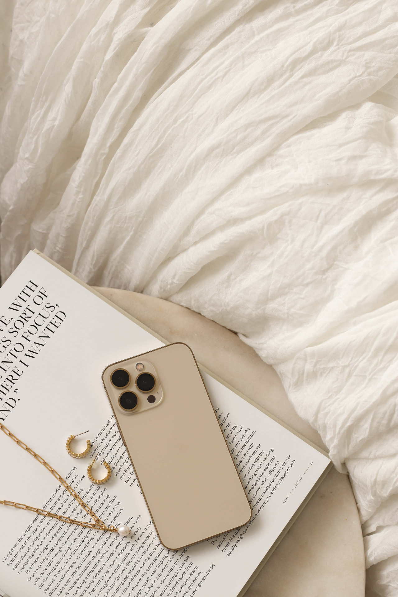 Styled flat lay with a phone and magazine representing the quick start guide